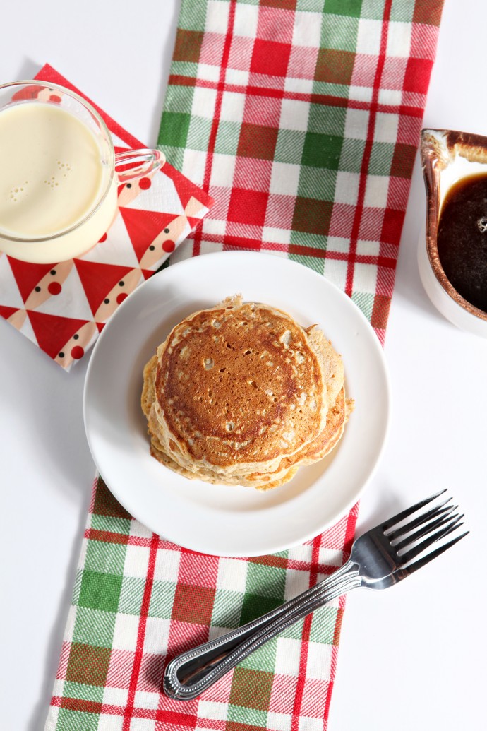 'Tis the season for eggnog and decadent breakfast! These Eggnog Pancakes with Cinnamon Syrup are the perfect Christmas Day treat to devour after opening presents beneath the tree.