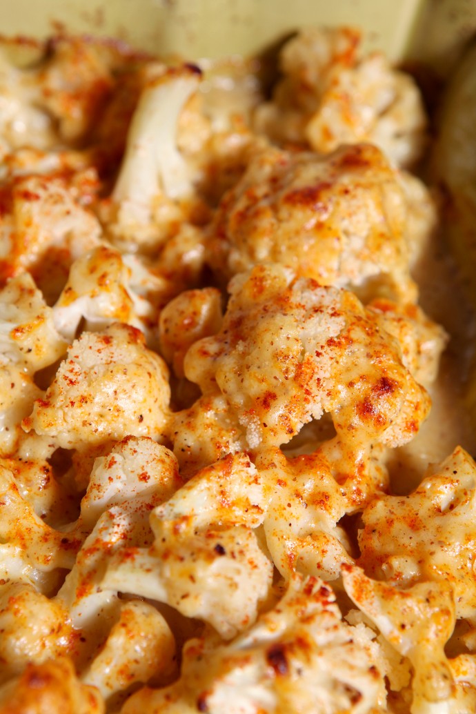 Cauliflower is drizzled with a creamy, spicy cheddar cheese sauce to make a decadent and simple side dish that is ready in 30 minutes!
